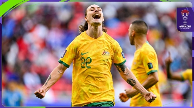 Pemain timnas Australia, Jackson Irvine melakukan selebrasi usai mencetak gol pembuka timnya ke gawang India dalam matchday pertama Grup B Piala Asia 2023 di Stadion Ahmad Bin Ali, Qatar, Sabtu (13/1/2024). [Dok. AFC]